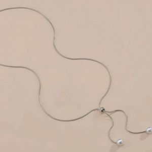 - Silver adjustable pearl necklace